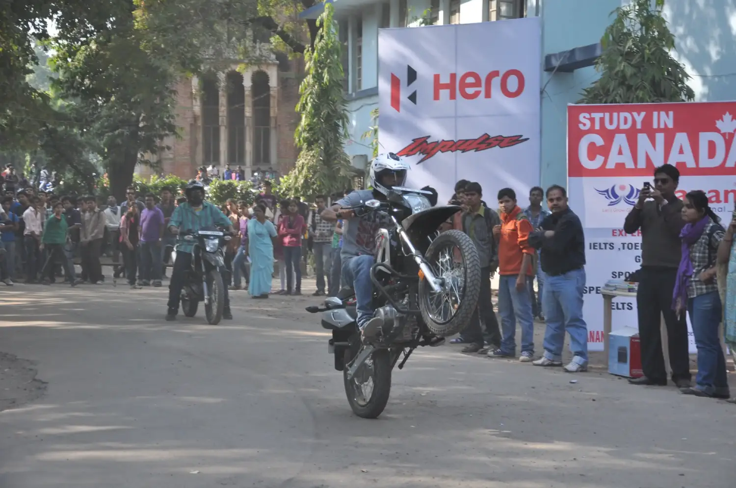 Man in suit speaking at podium with ITT logo on podium